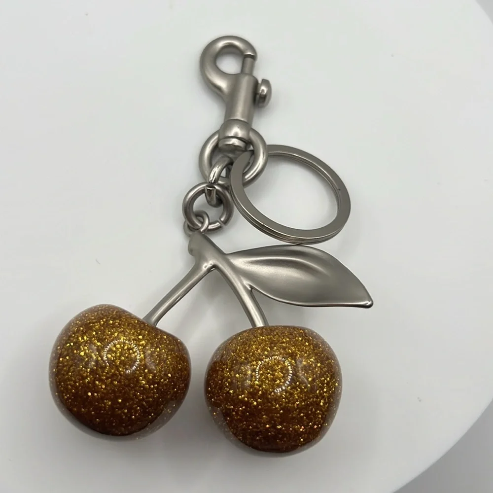 60. Gold Glittery‎ Cherry Keychain